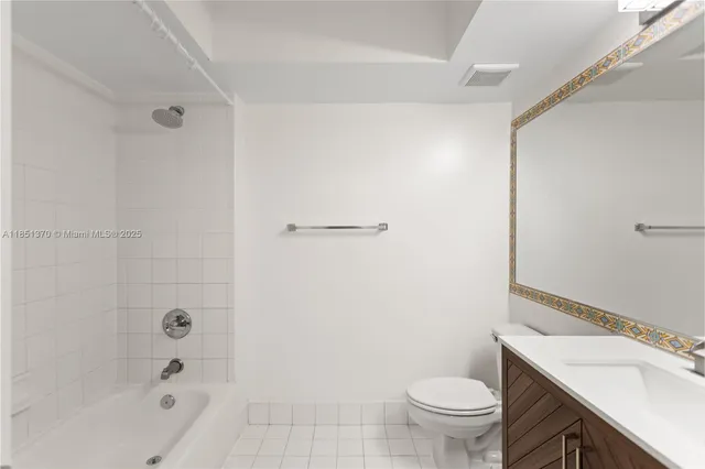 a swimming pool with outdoor seating and a garden