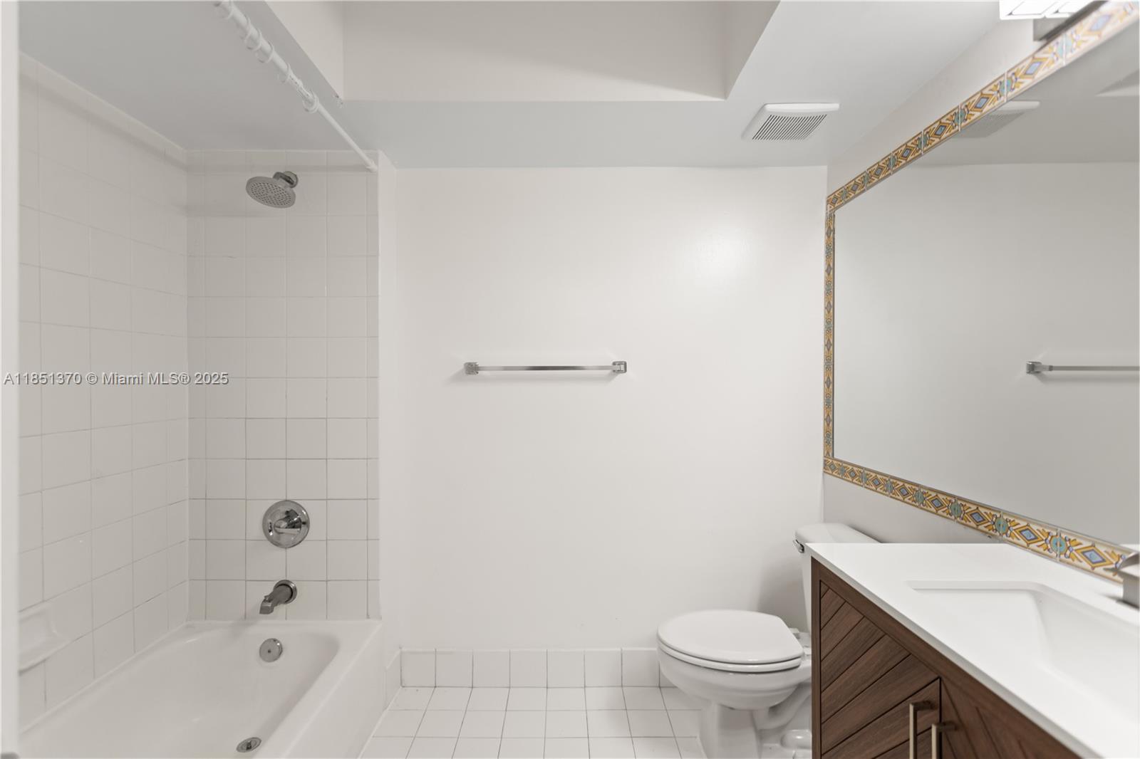 9645 Northwest 1st Court, Unit 1209 Pembroke Pines, FL 33024 - Photo 44 of 70 a bathroom with a sink a toilet and shower