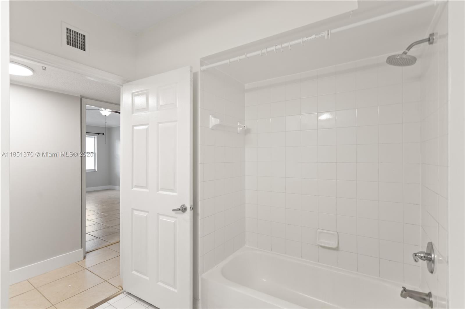 9645 Northwest 1st Court, Unit 1209 Pembroke Pines, FL 33024 - Photo 45 of 70 a bathroom with a bathtub and a shower