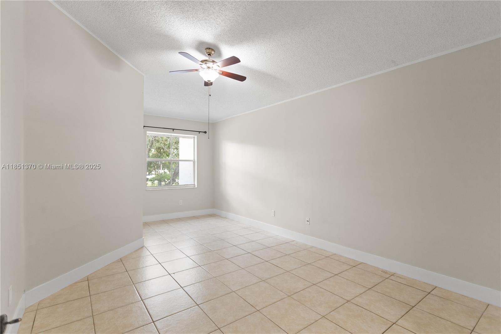 9645 Northwest 1st Court, Unit 1209 Pembroke Pines, FL 33024 - Photo 47 of 70 a view of an empty room with a window