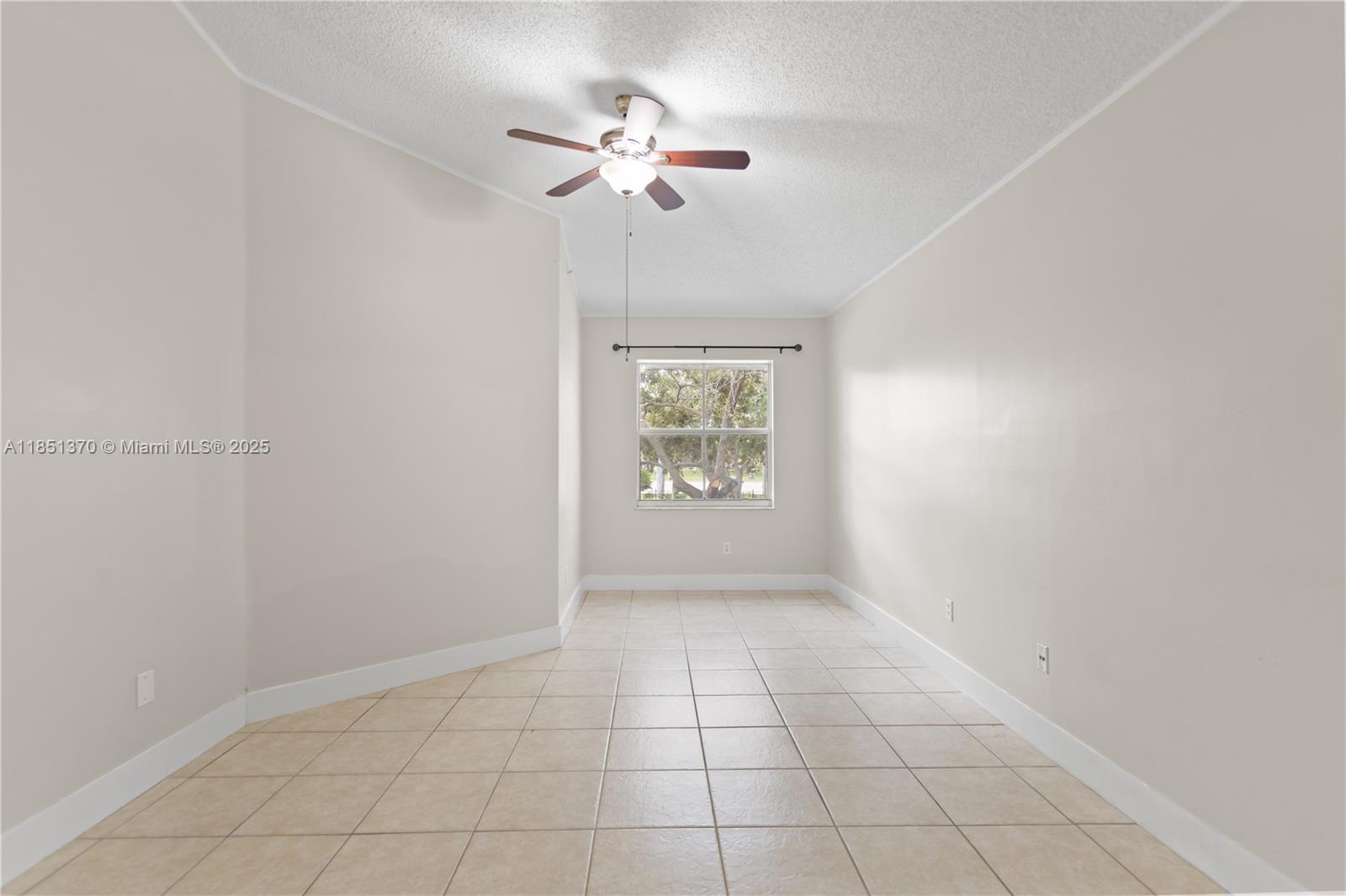 9645 Northwest 1st Court, Unit 1209 Pembroke Pines, FL 33024 - Photo 48 of 70 an empty room with windows and fan