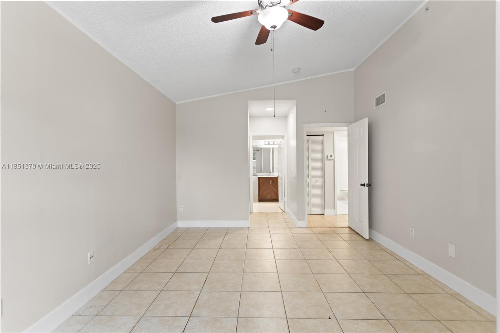9645 Northwest 1st Court, Unit 1209 Pembroke Pines, FL 33024 - Photo 52 of 70 a view of an empty room with a ceiling fan