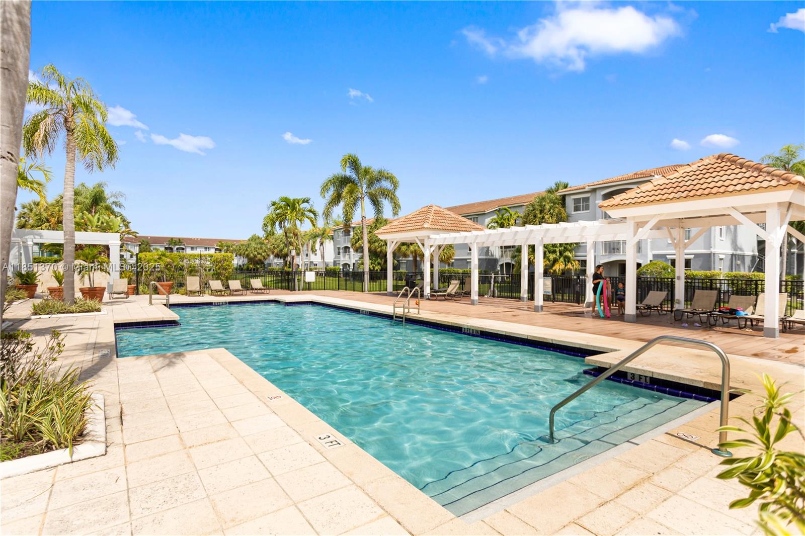 9645 Northwest 1st Court, Unit 1209 Pembroke Pines, FL 33024 - Photo 63 of 70 a view of a house with swimming pool and sitting area