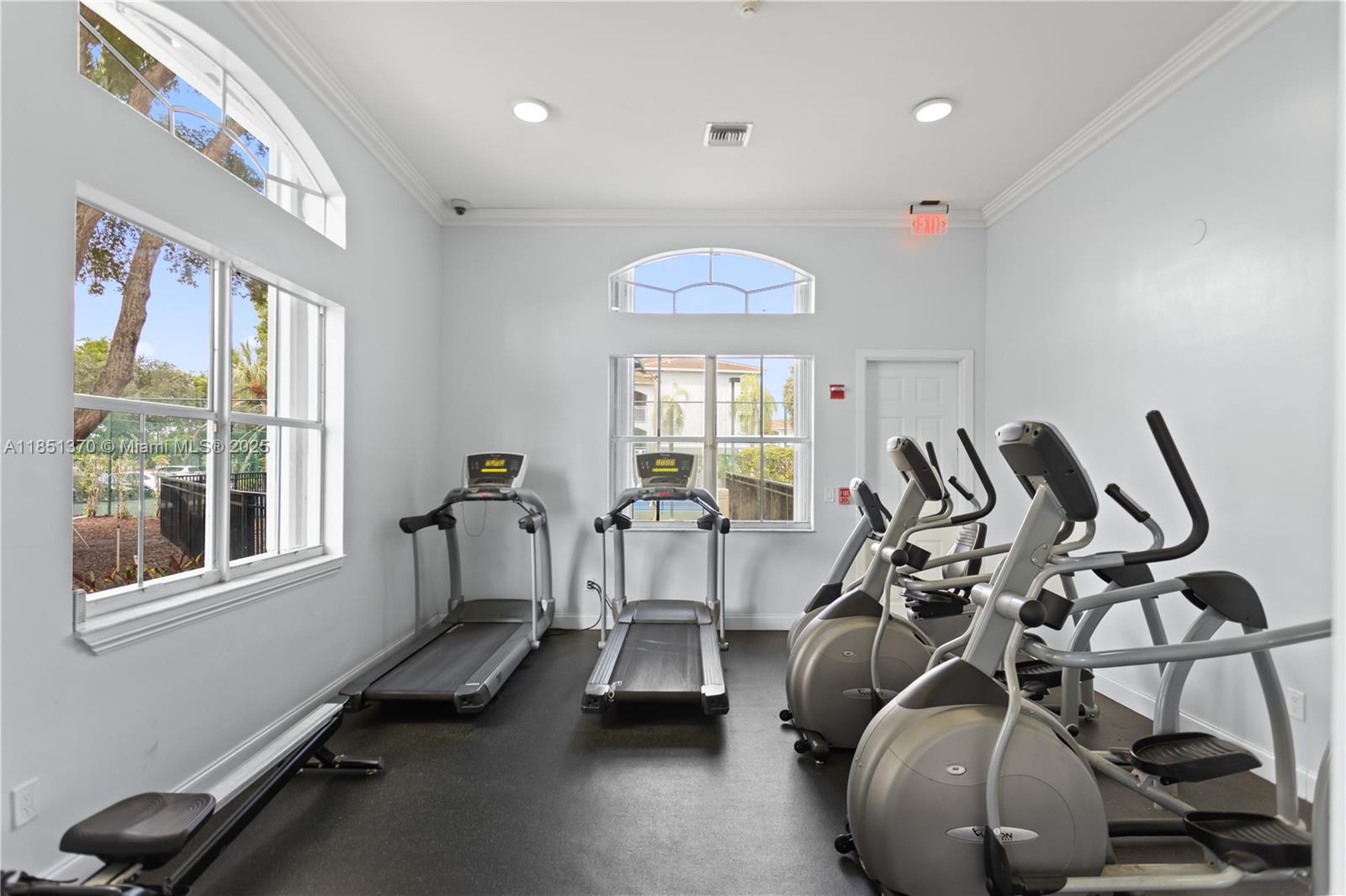 9645 Northwest 1st Court, Unit 1209 Pembroke Pines, FL 33024 - Photo 68 of 70 a view of a room with gym equipment
