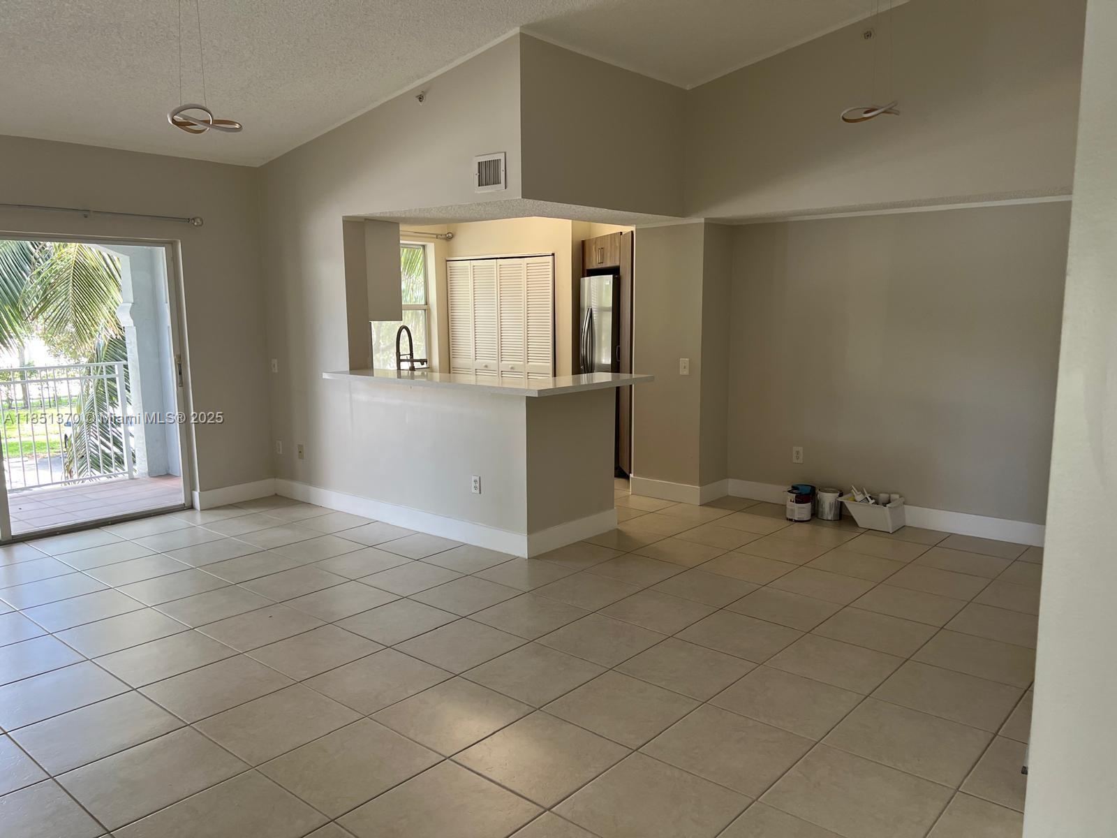 9645 Northwest 1st Court, Unit 1209 Pembroke Pines, FL 33024 - Photo 7 of 70 an empty room with windows and closet