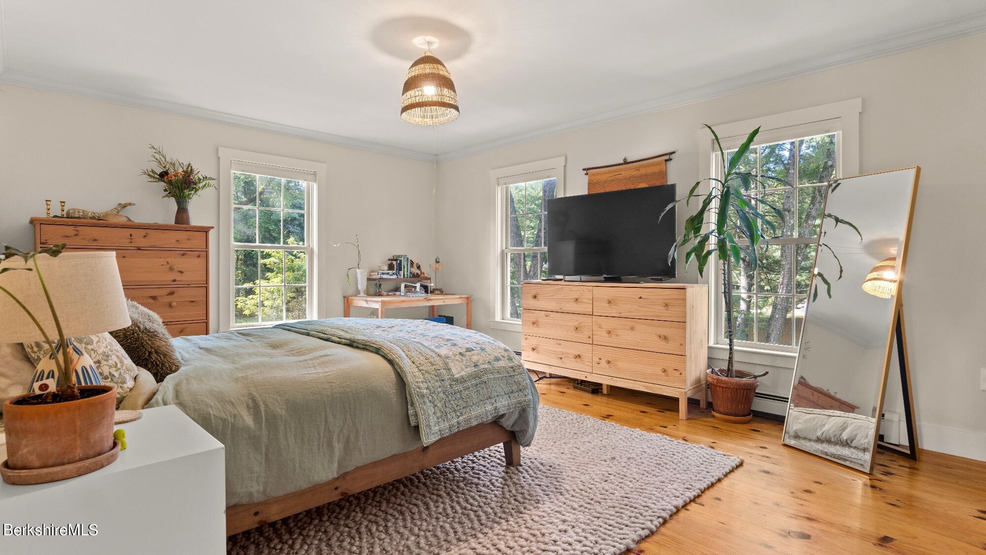 508 Polikoff Road Sheffield, MA 01222 - Photo 18 of 28 a bedroom with a bed and a flat screen tv