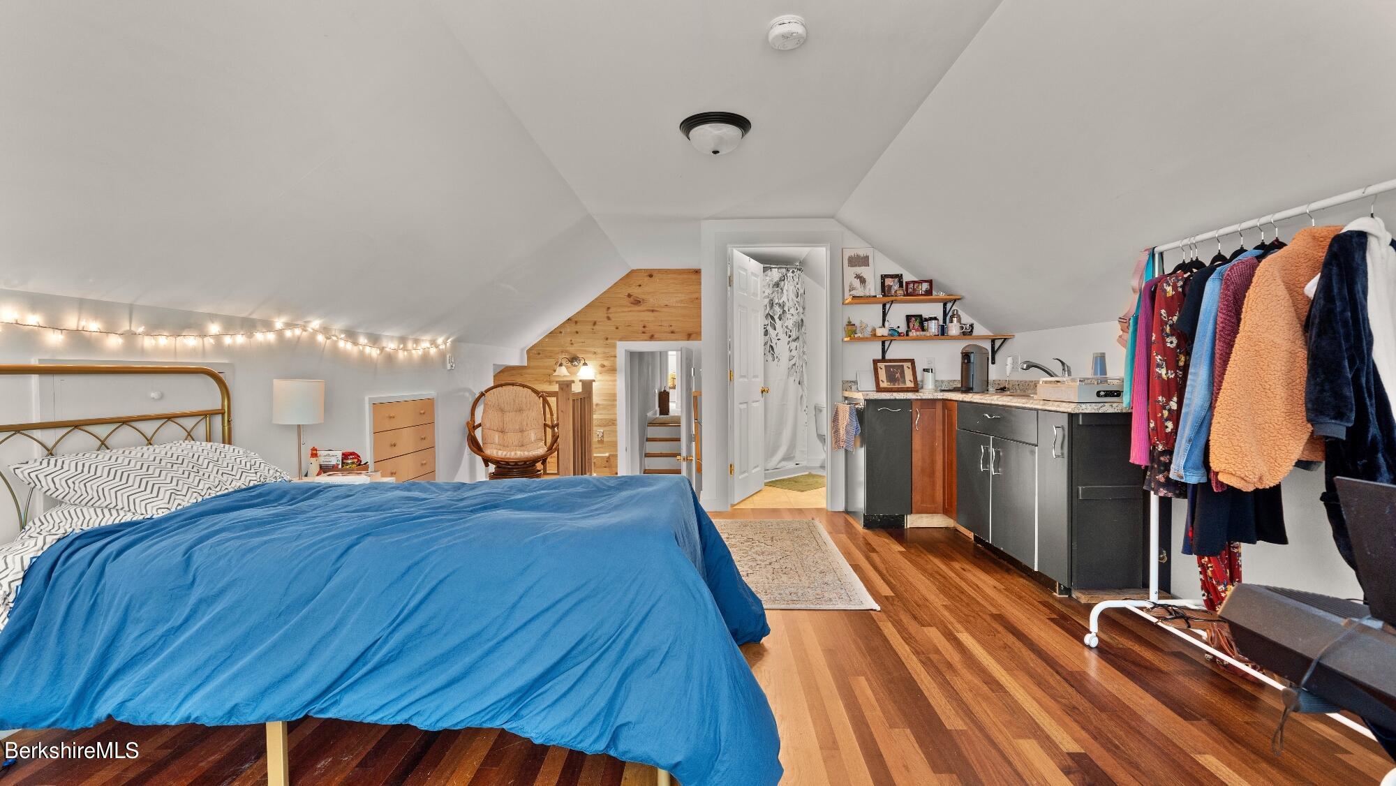 508 Polikoff Road Sheffield, MA 01222 - Photo 24 of 28 a bed room with a bed and a walk in closet