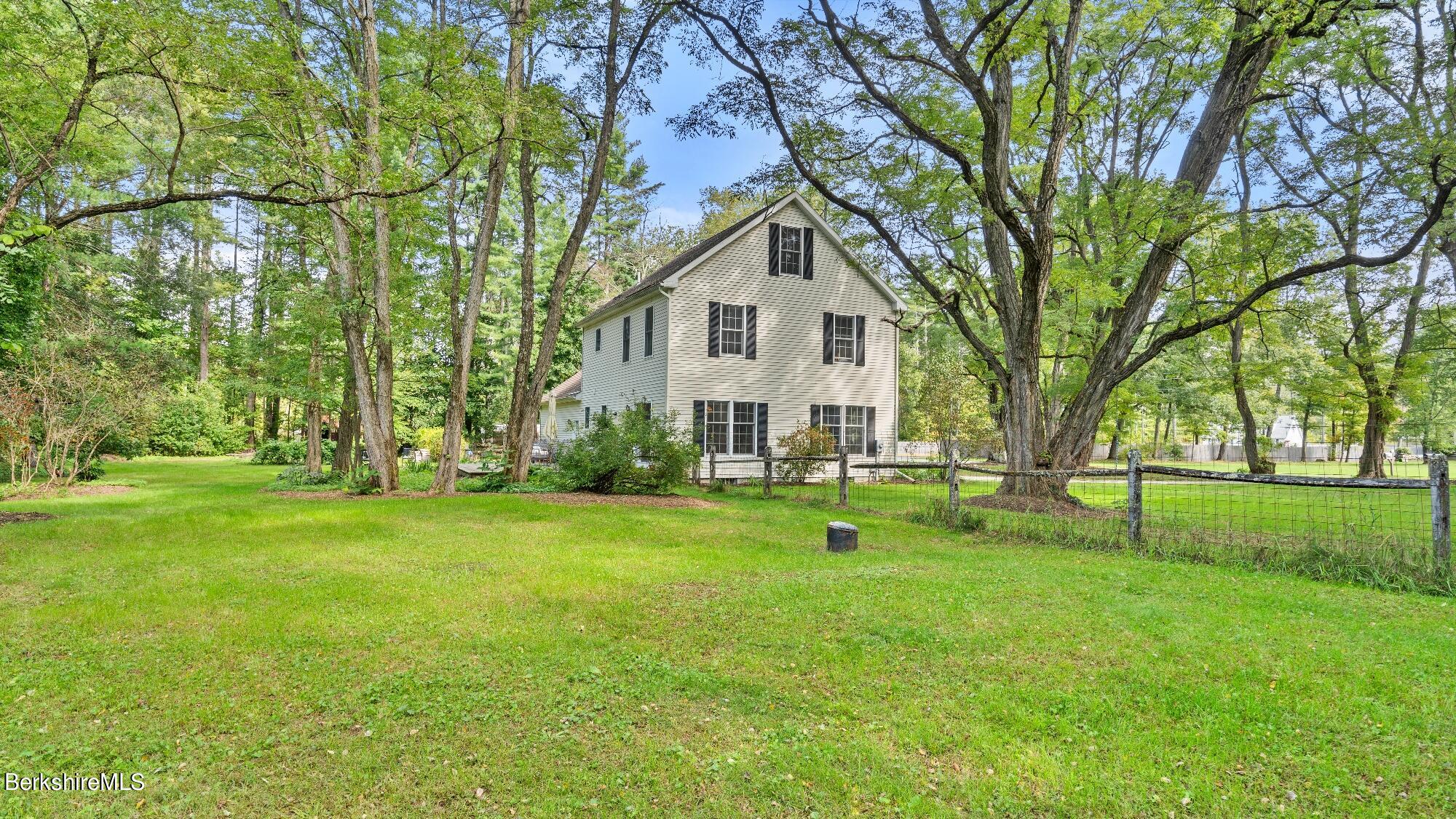 508 Polikoff Road Sheffield, MA 01222 - Photo 5 of 28 a view of a house with a yard and sitting area
