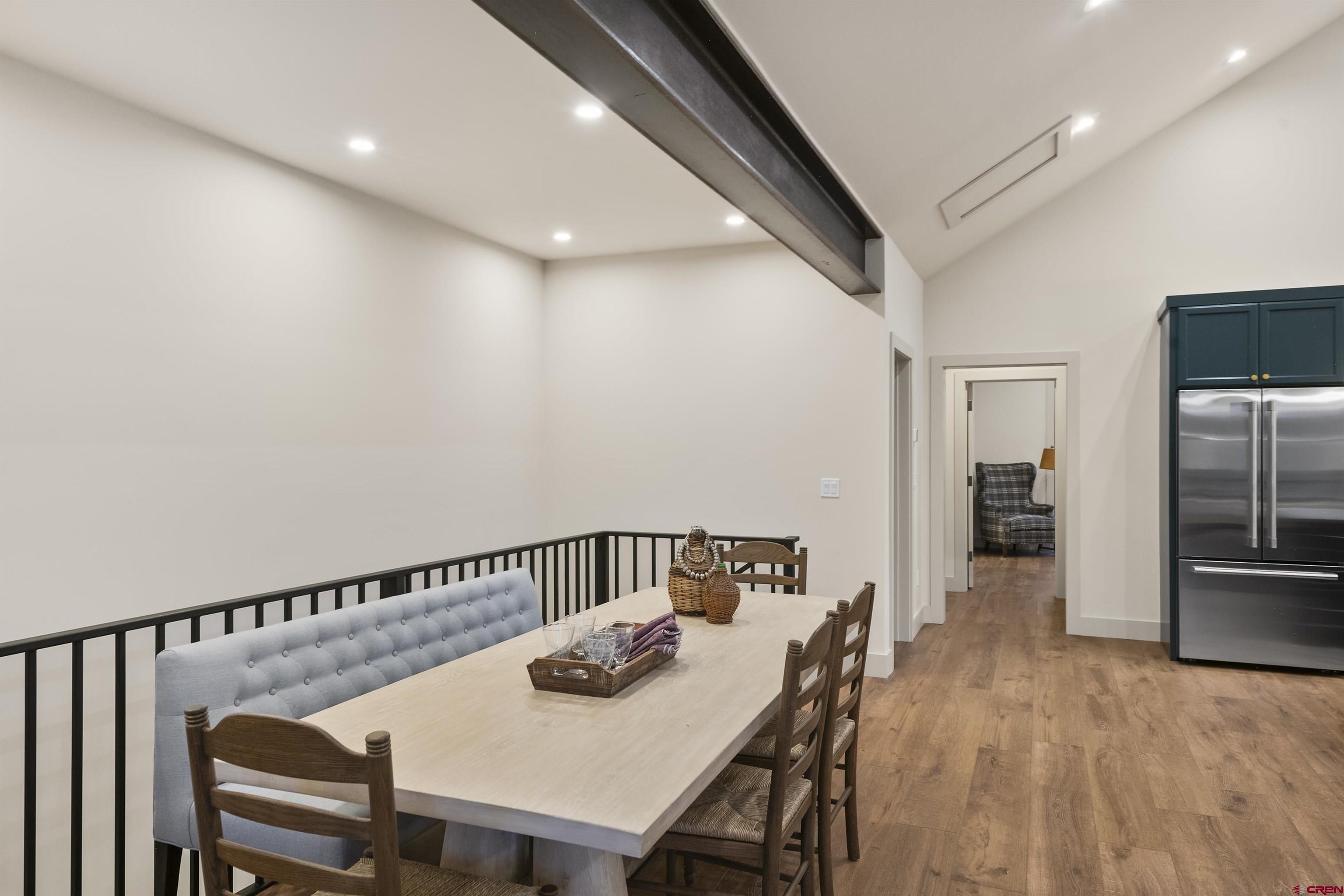 180 Elk Valley Road, Unit 118 Crested Butte, CO 81224 - Photo 15 of 39 a view of a dining area with furniture and wooden floor