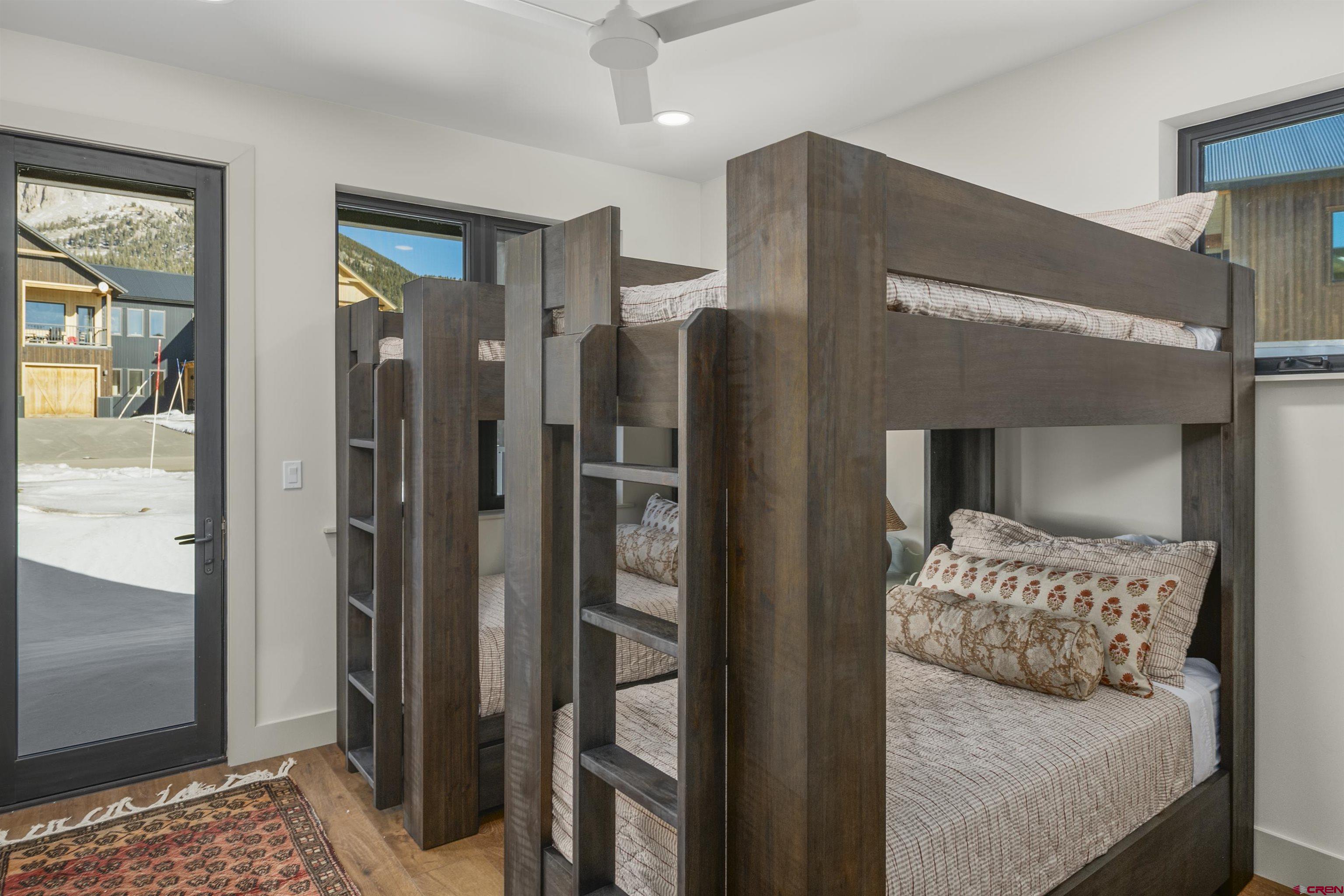 180 Elk Valley Road, Unit 118 Crested Butte, CO 81224 - Photo 31 of 39 a en suite bathroom with a shower and a mirror