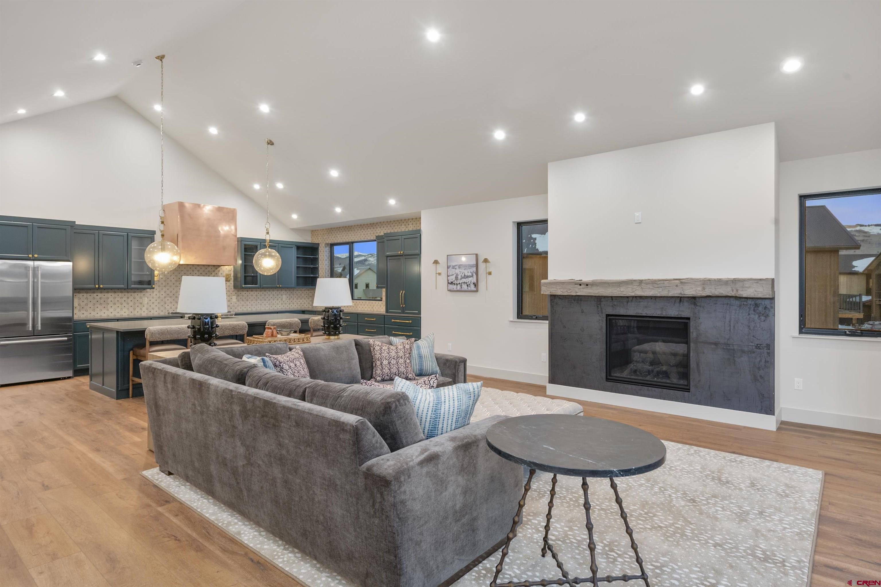 180 Elk Valley Road, Unit 118 Crested Butte, CO 81224 - Photo 8 of 39 a living room with furniture and a fireplace