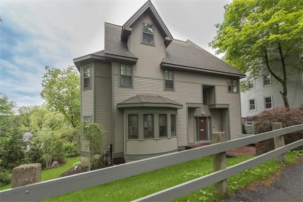 221 Reservoir Road Brookline, MA 02467 - Photo 1 of 30 a front view of a house with a garden
