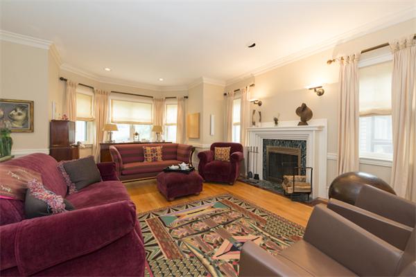 221 Reservoir Road Brookline, MA 02467 - Photo 3 of 30 a living room with furniture a rug and a fireplace