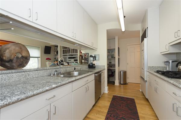 221 Reservoir Road Brookline, MA 02467 - Photo 10 of 30 a kitchen with stainless steel appliances granite countertop a sink and cabinets