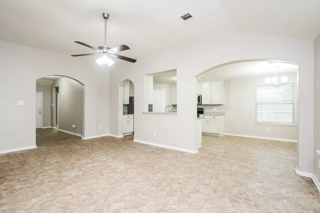 a view of a big room with closet and windows