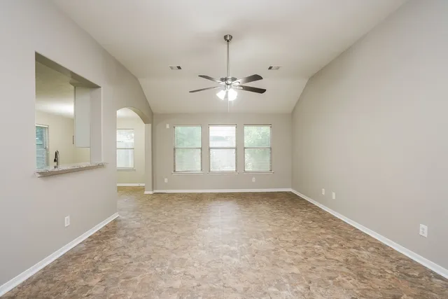 a view of an empty room with a window