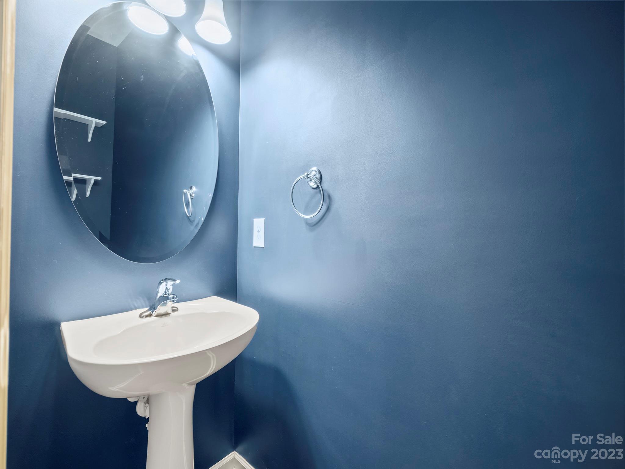 13723 Porter Creek Road Charlotte, NC 28262 - Photo 21 of 40 a bathroom with a sink and a mirror