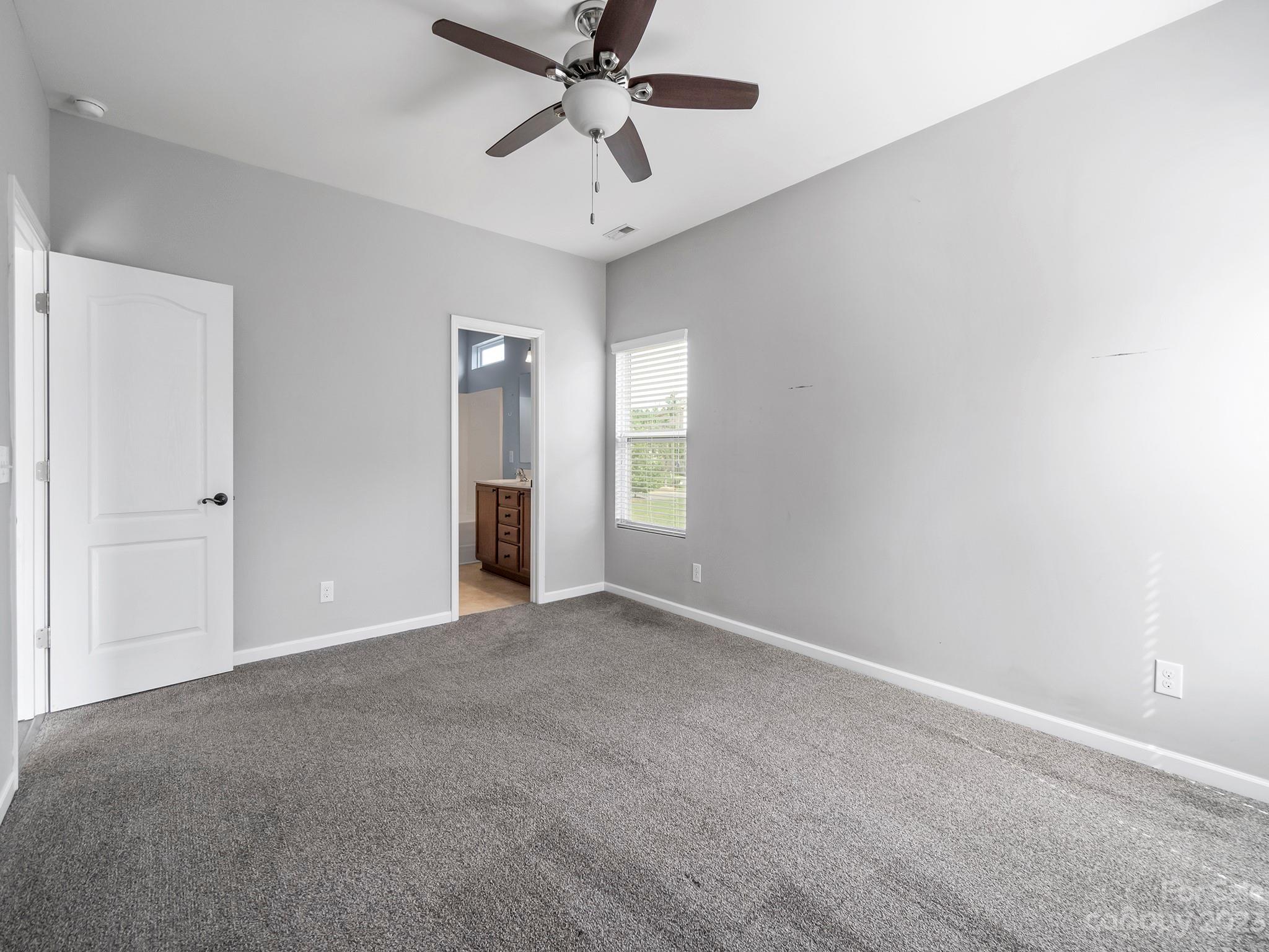 13723 Porter Creek Road Charlotte, NC 28262 - Photo 24 of 40 a view of an empty room with a window