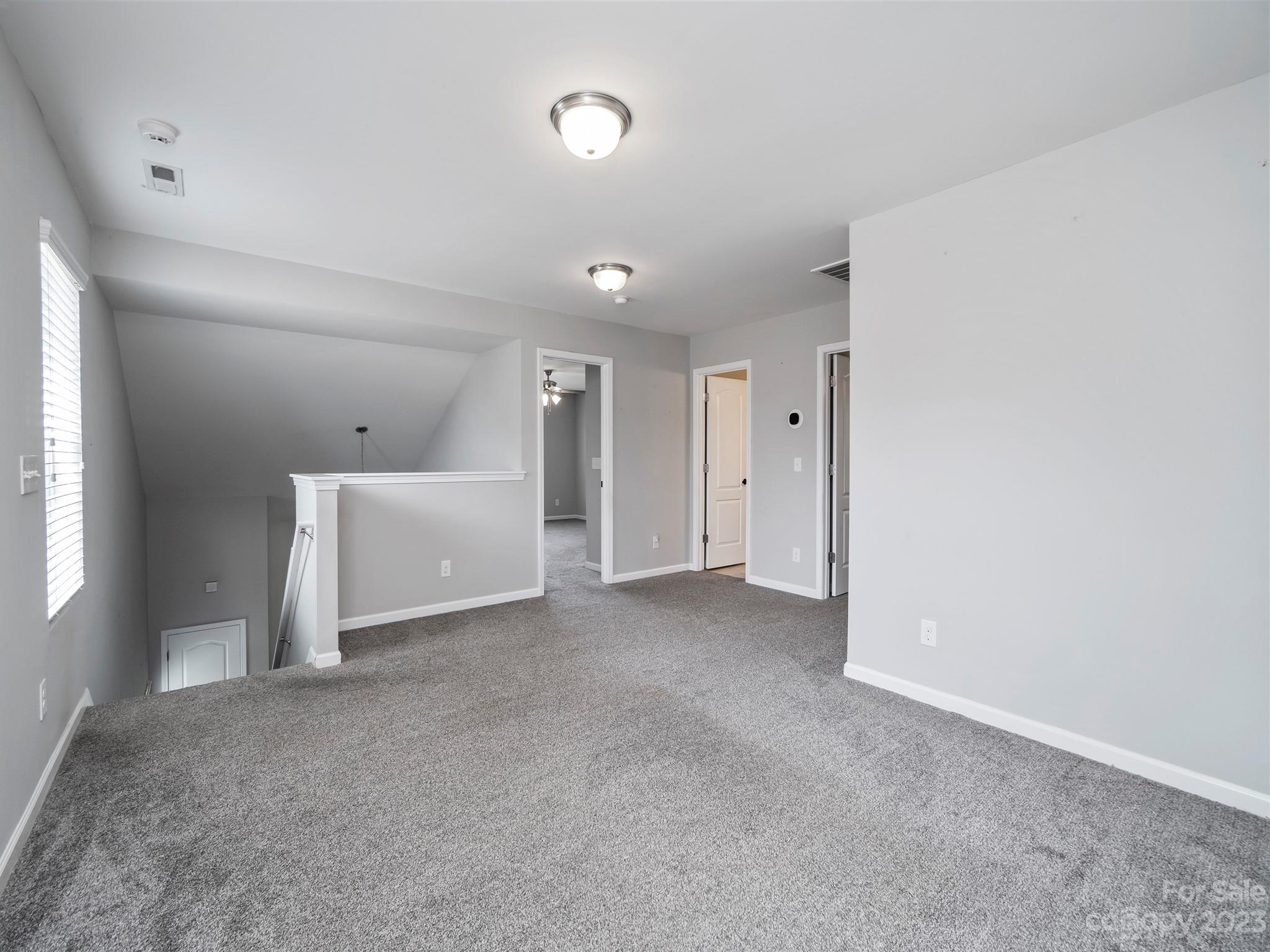13723 Porter Creek Road Charlotte, NC 28262 - Photo 26 of 40 a view of a livingroom with an empty space