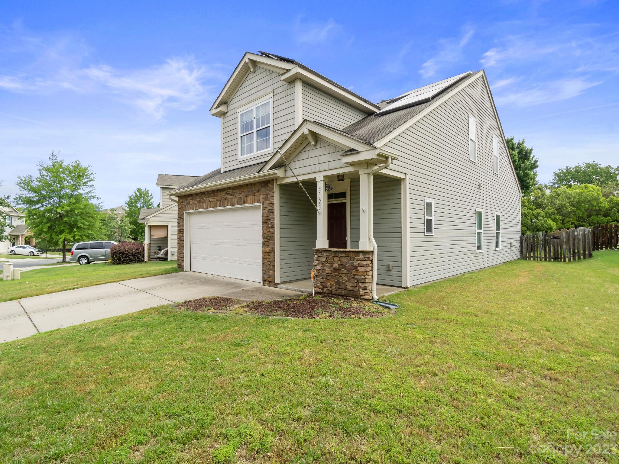 13723 Porter Creek Road Charlotte, NC 28262 - Photo 3 of 40 a view of a house with a yard