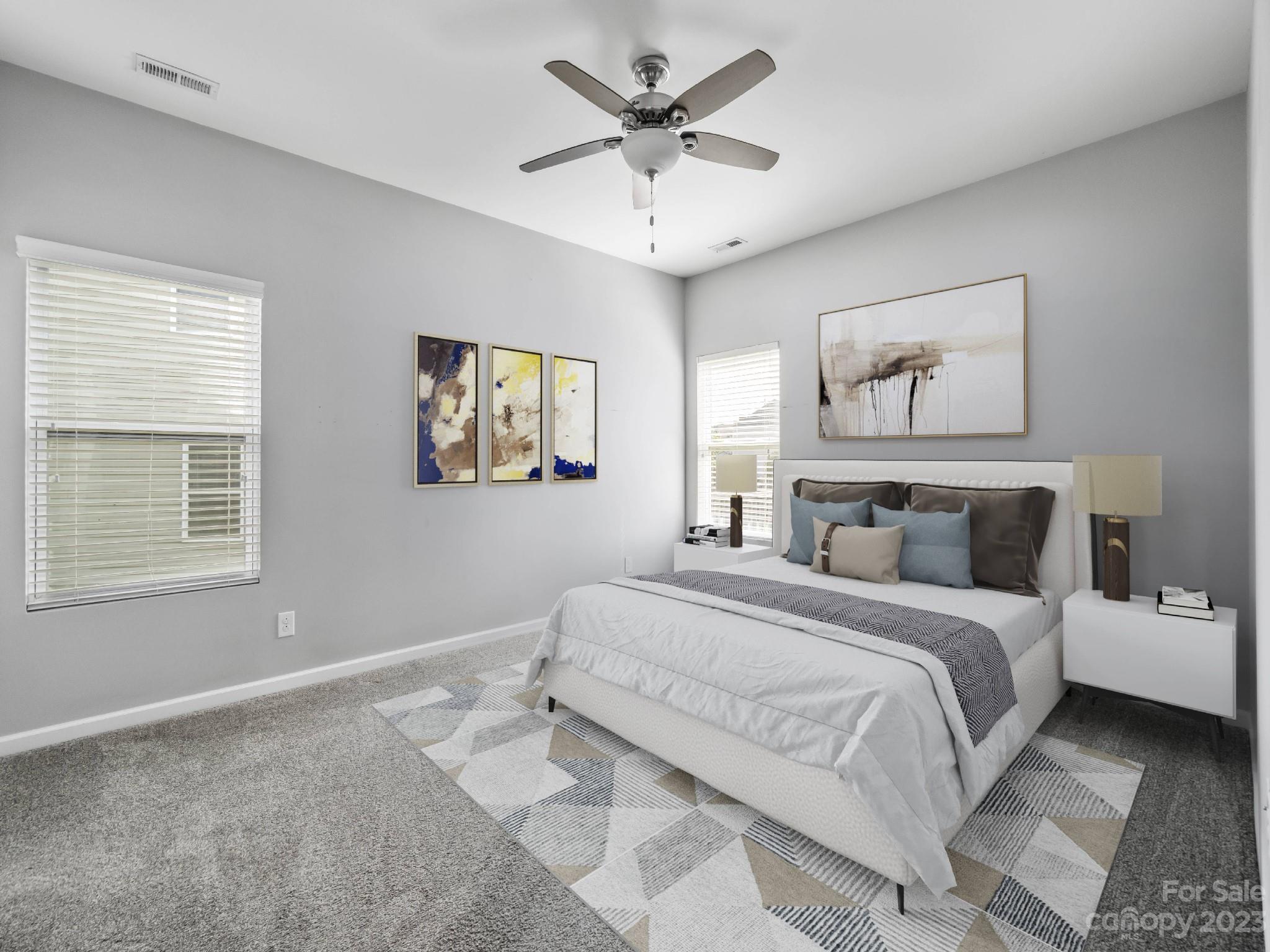 13723 Porter Creek Road Charlotte, NC 28262 - Photo 9 of 40 a spacious bedroom with a bed and a window