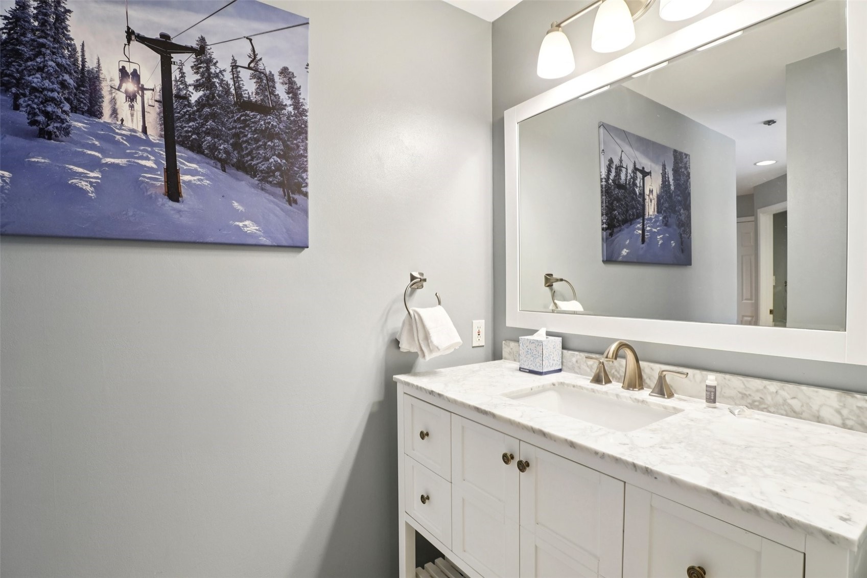 24 River Run Road, Unit 2907 Keystone, CO 80435 - Photo 19 of 37 a bathroom with a granite countertop sink a mirror and vanity