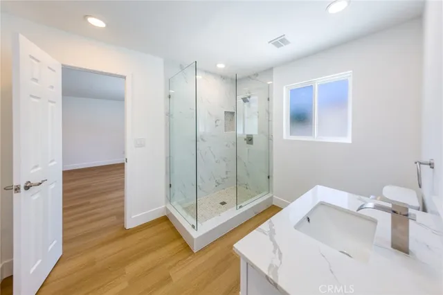 a bathroom with a shower and a tub