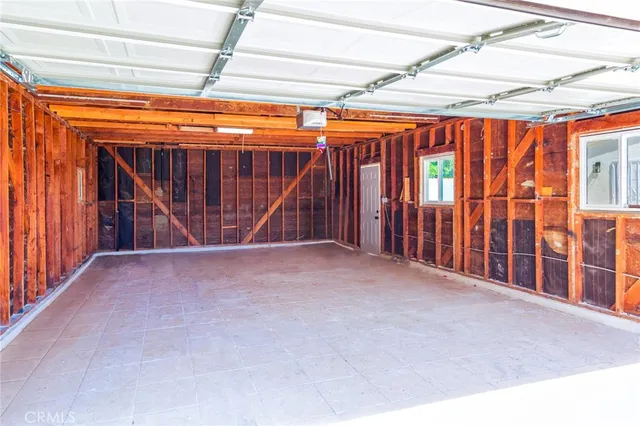 a view of a room with wooden walls