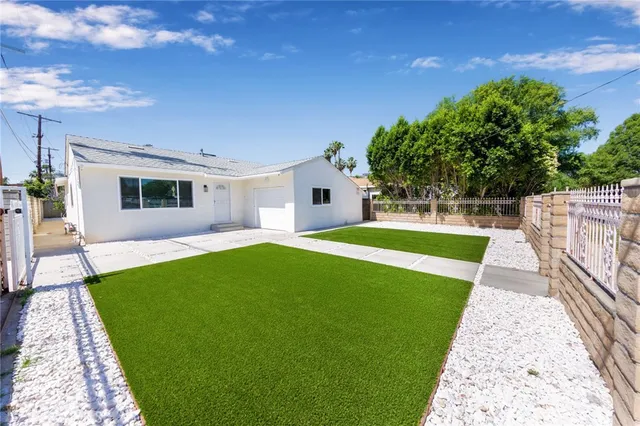 a view of yard with swimming pool and green space