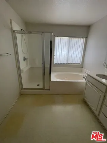 a view of walk in closet with window