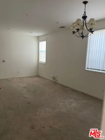 a view of empty room with windows