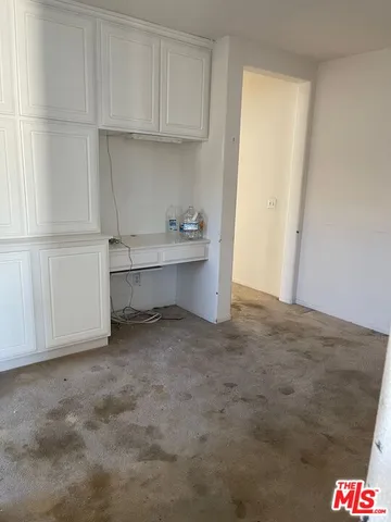 a view of cabinets and wooden floor