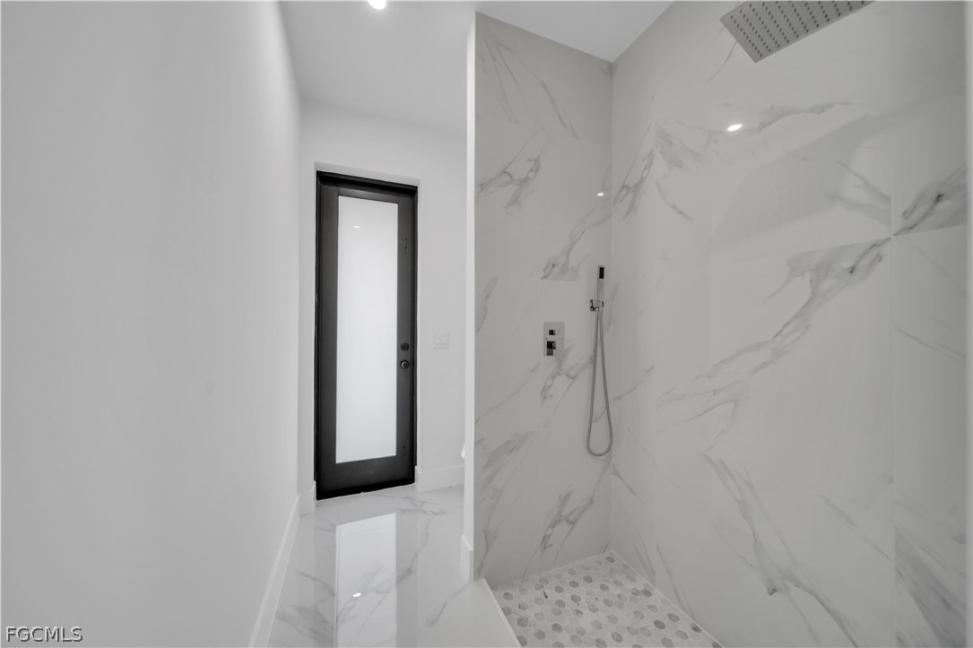 5003 2nd Street West Lehigh Acres, FL 33971 - Photo 9 of 21 a bathroom with a shower