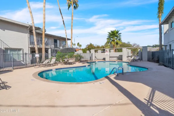 a view of a swimming pool with a house