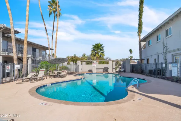 a view of a swimming pool with a patio