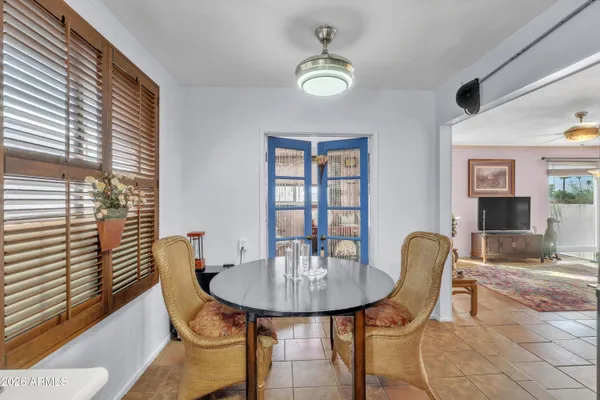 a view of a dining room with furniture and window