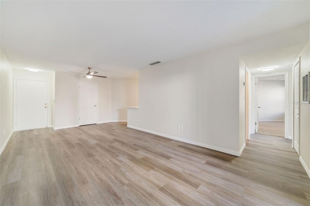 3908 Atrium Drive, Unit L5 Orlando, FL 32822 - Photo 5 of 17 a view of empty room with wooden floor
