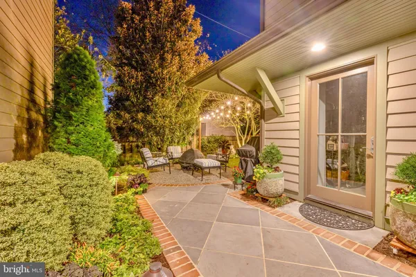 a bathroom with a granite countertop toilet sink and mirror