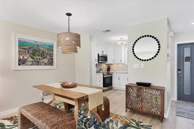a living room with furniture a window and a lamp