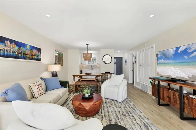 a kitchen with granite countertop a sink a stove and cabinets