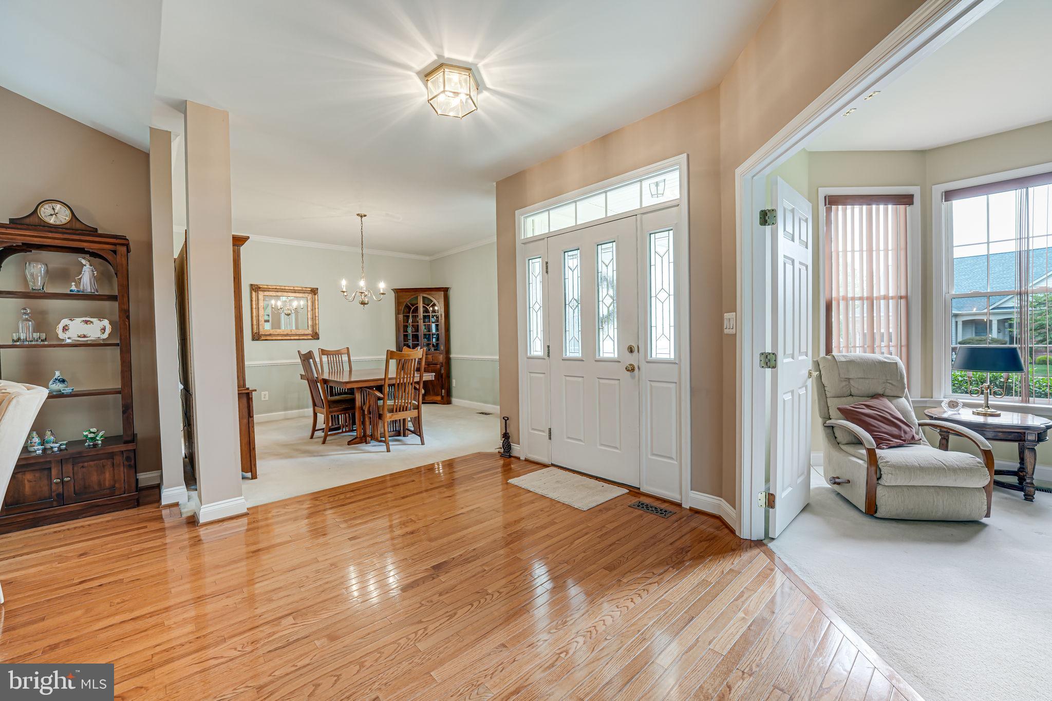 6717 Buglecall Place Gainesville, VA 20155 - Photo 5 of 44 Foyer looking into Dining Room and Den