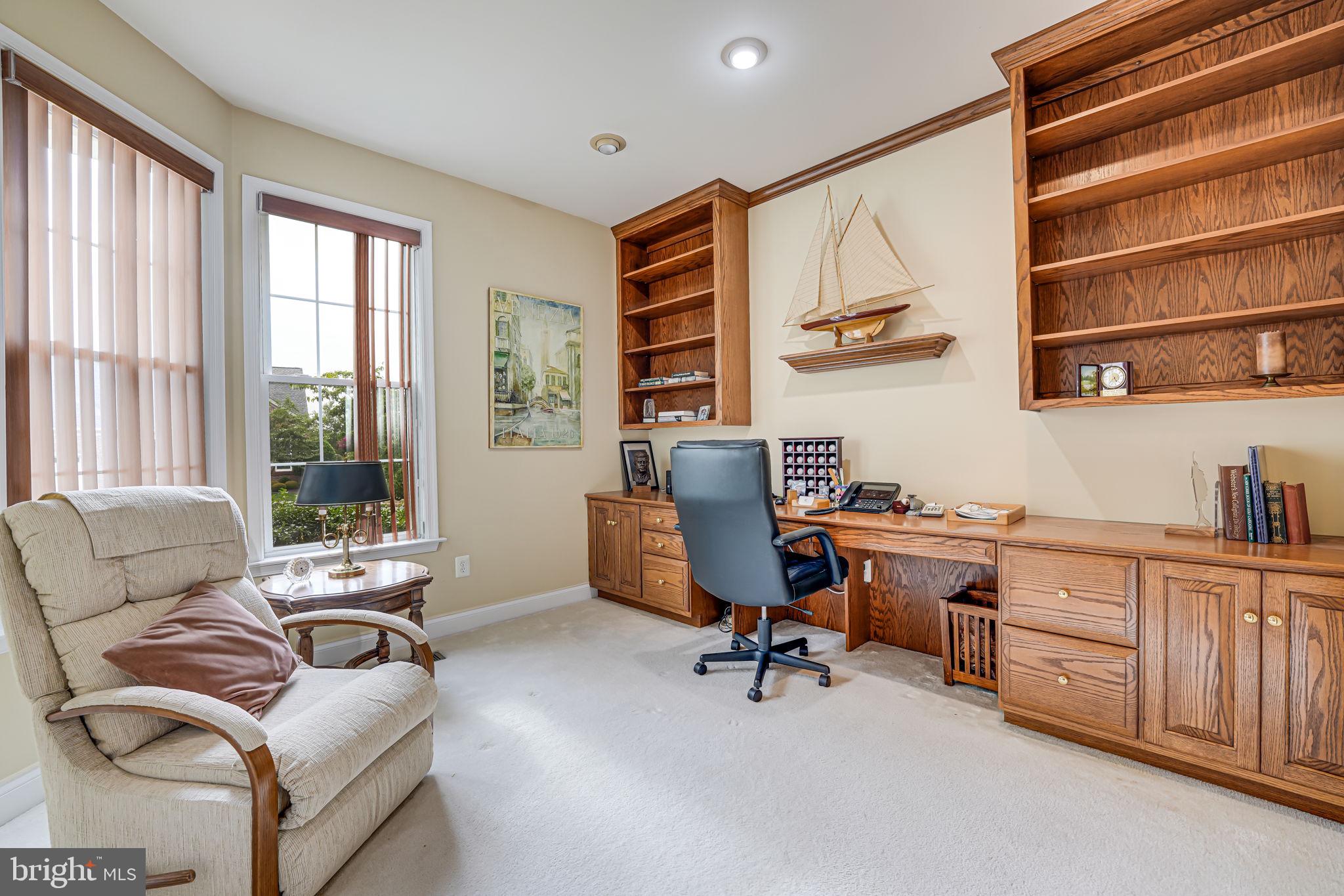 6717 Buglecall Place Gainesville, VA 20155 - Photo 8 of 44 Study with Built-in Desk and Shelving