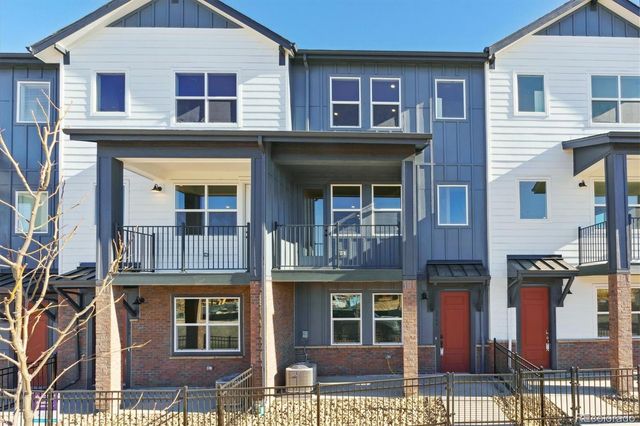 a view of building with a window and balcony