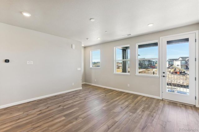 a large kitchen with stainless steel appliances kitchen island a large counter top and a stove top oven