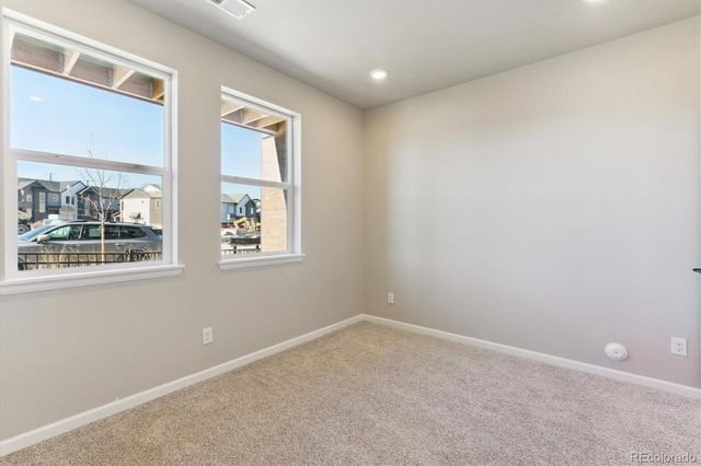 a view of a hallway with closet and wooden floor
