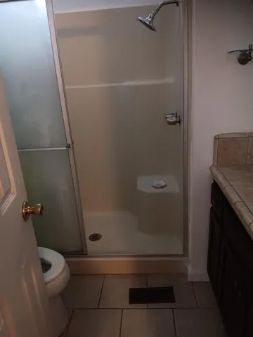 a bathroom with a granite countertop sink