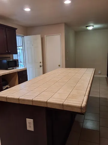 a room with a bed and a television