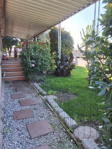 a view of yard with patio
