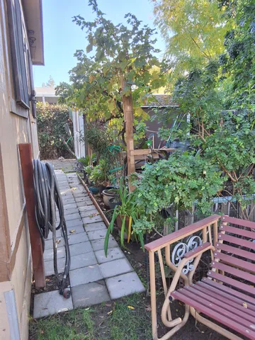 a view of an outdoor sitting area with brick walls