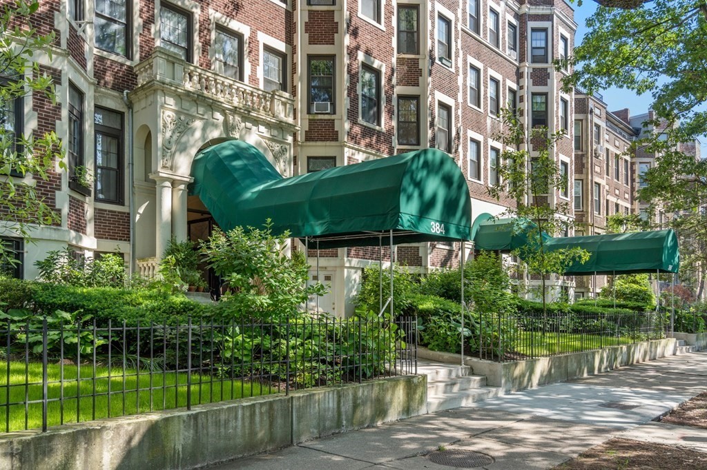 384 Riverway, Unit 5 Boston, MA 02115 - Photo 19 of 20 a view of a lake with a building in the background